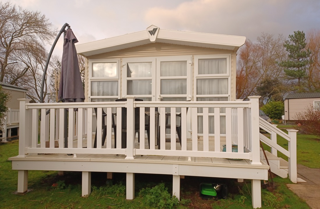 Front view of the caravan and decking